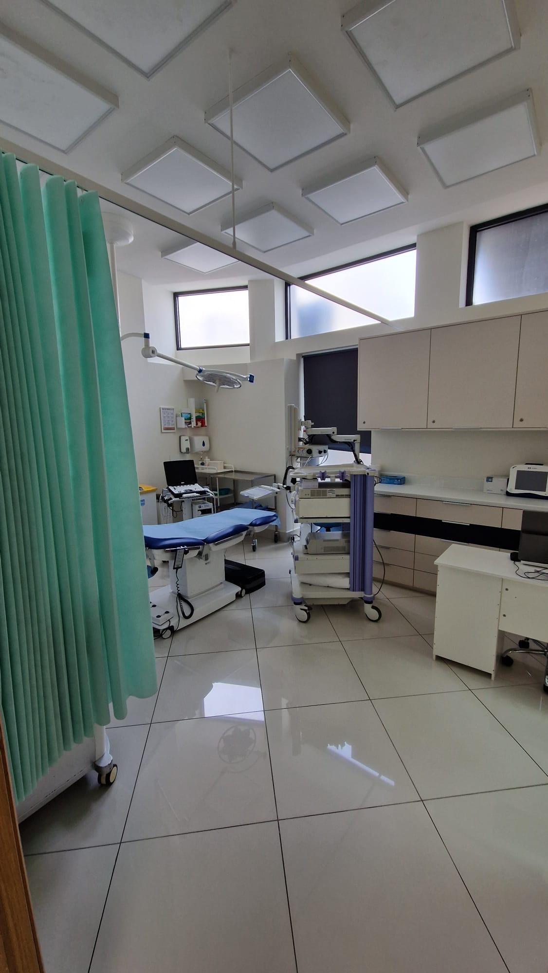 Private gynaecology procedure room with examination chair and ultrasound at SW11 Medical Clinic